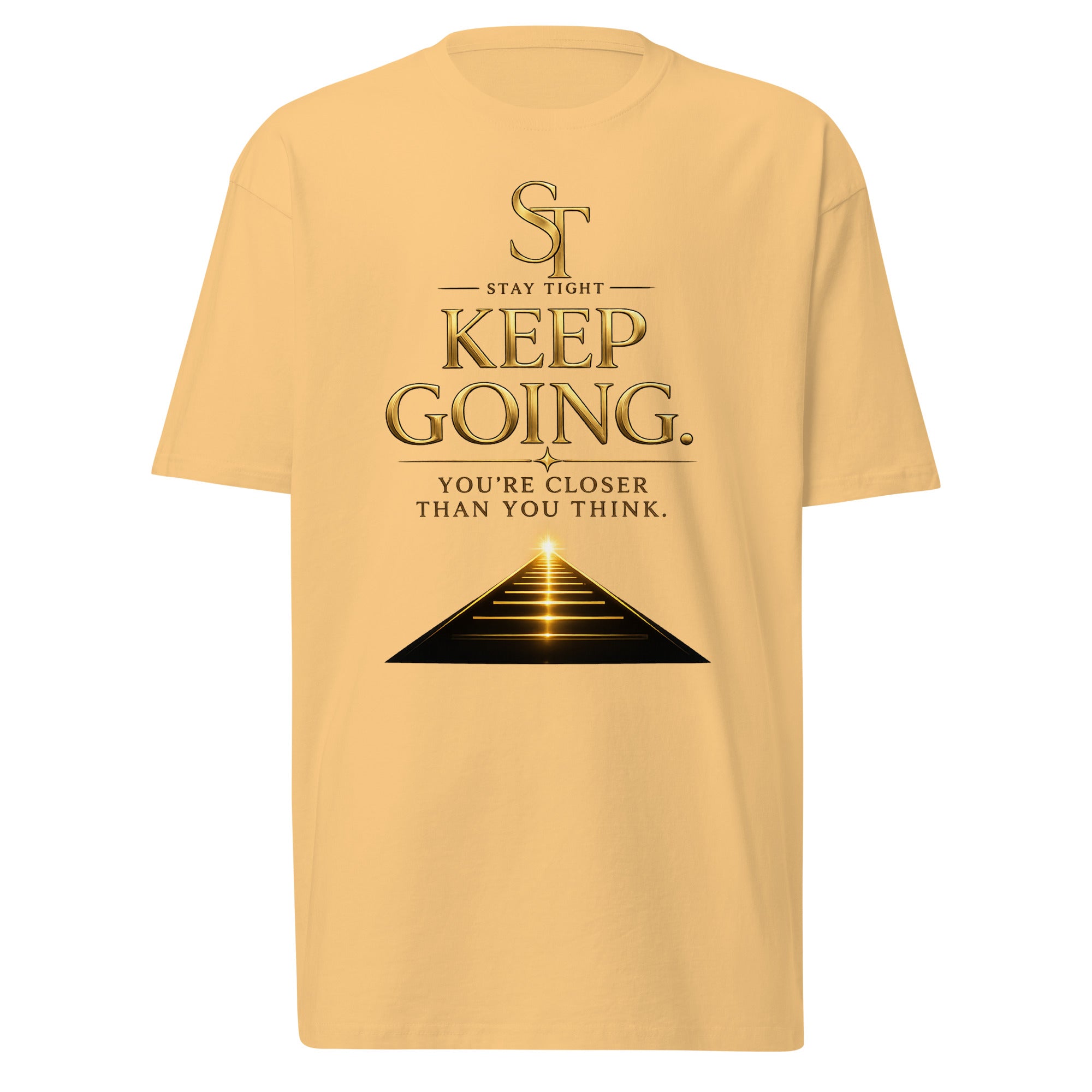 Stay Tight premium heavyweight T-shirt featuring the motivational message "Keep Going. You're Closer Than You Think." with a glowing path leading toward the horizon beneath the ST logo, symbolizing perseverance, resilience, hope, determination, and achieving your goals.
