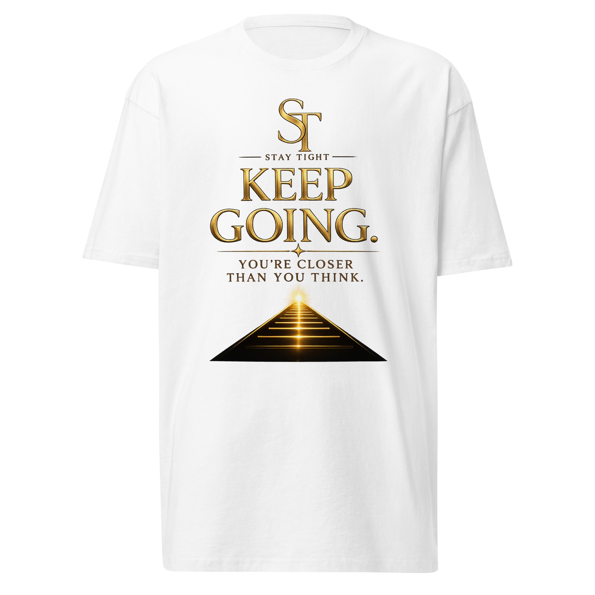 Stay Tight premium heavyweight T-shirt featuring the motivational message "Keep Going. You're Closer Than You Think." with a glowing path leading toward the horizon beneath the ST logo, symbolizing perseverance, resilience, hope, determination, and achieving your goals.