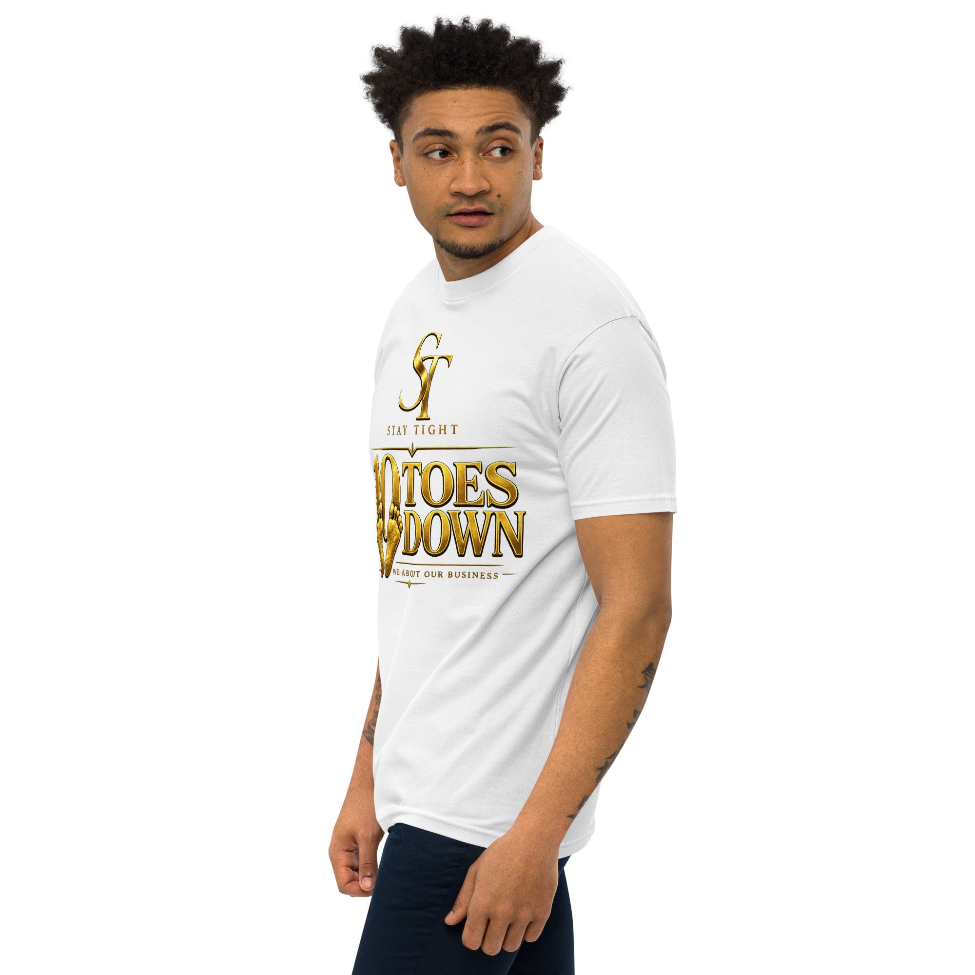premium heavyweight Stay Tight graphic T-shirt with a bold “10 Toes Down” design featuring gold footprints and the phrase “We About Our Business.” Motivational streetwear representing discipline, focus, loyalty, resilience, and commitment.